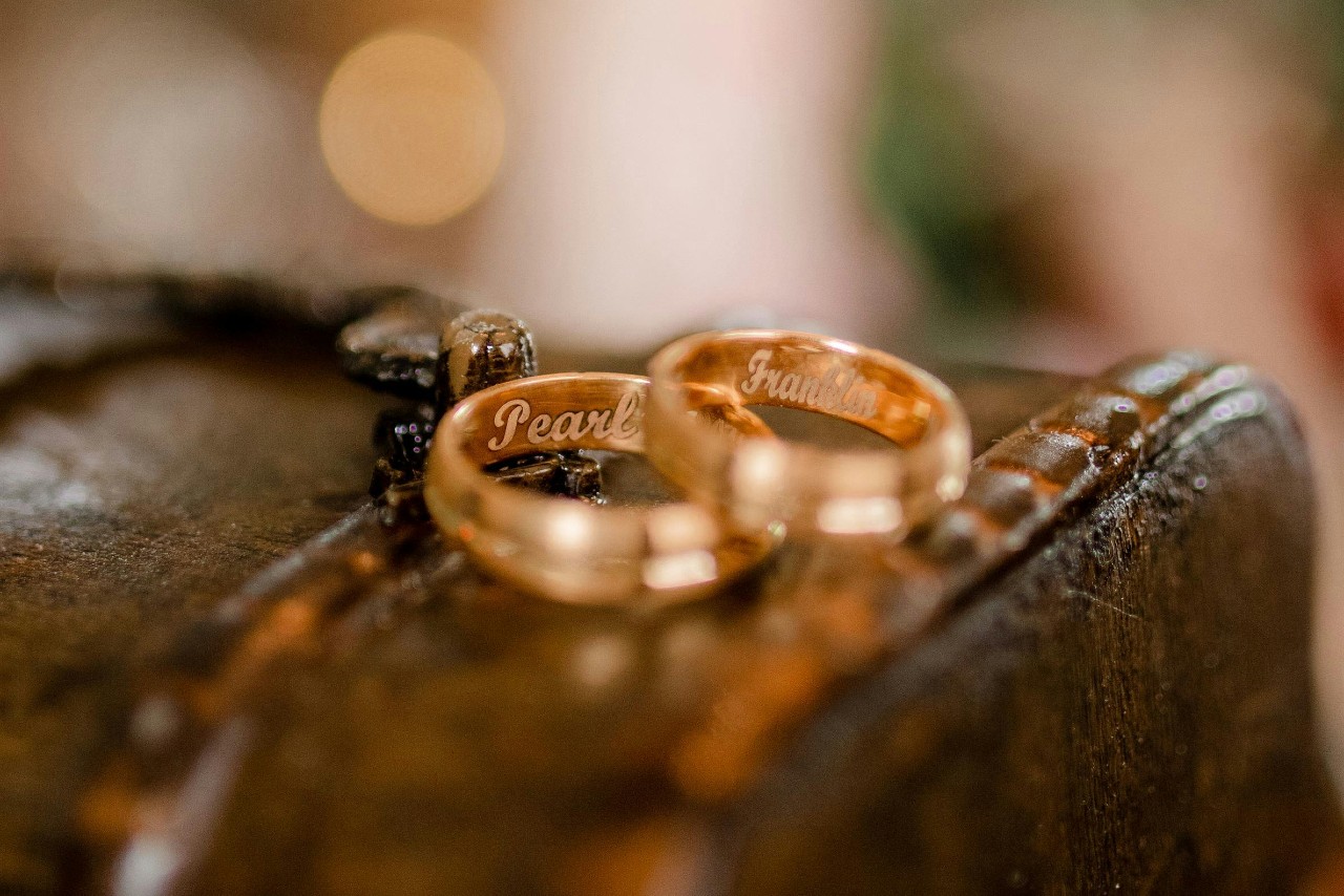 two gold rings with the names “Pearl” and “Franklin” engraved into them