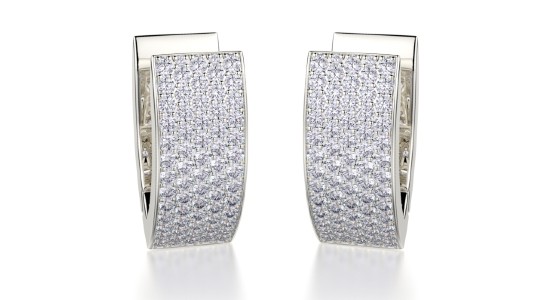 a white gold pair of diamond studded huggies earrings