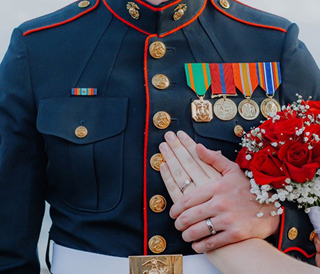 Image title service member holding a hand