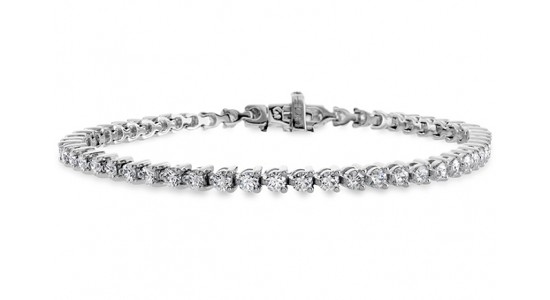a diamond tennis bracelet in a silver setting a diamond tennis bracelet in a silver setting