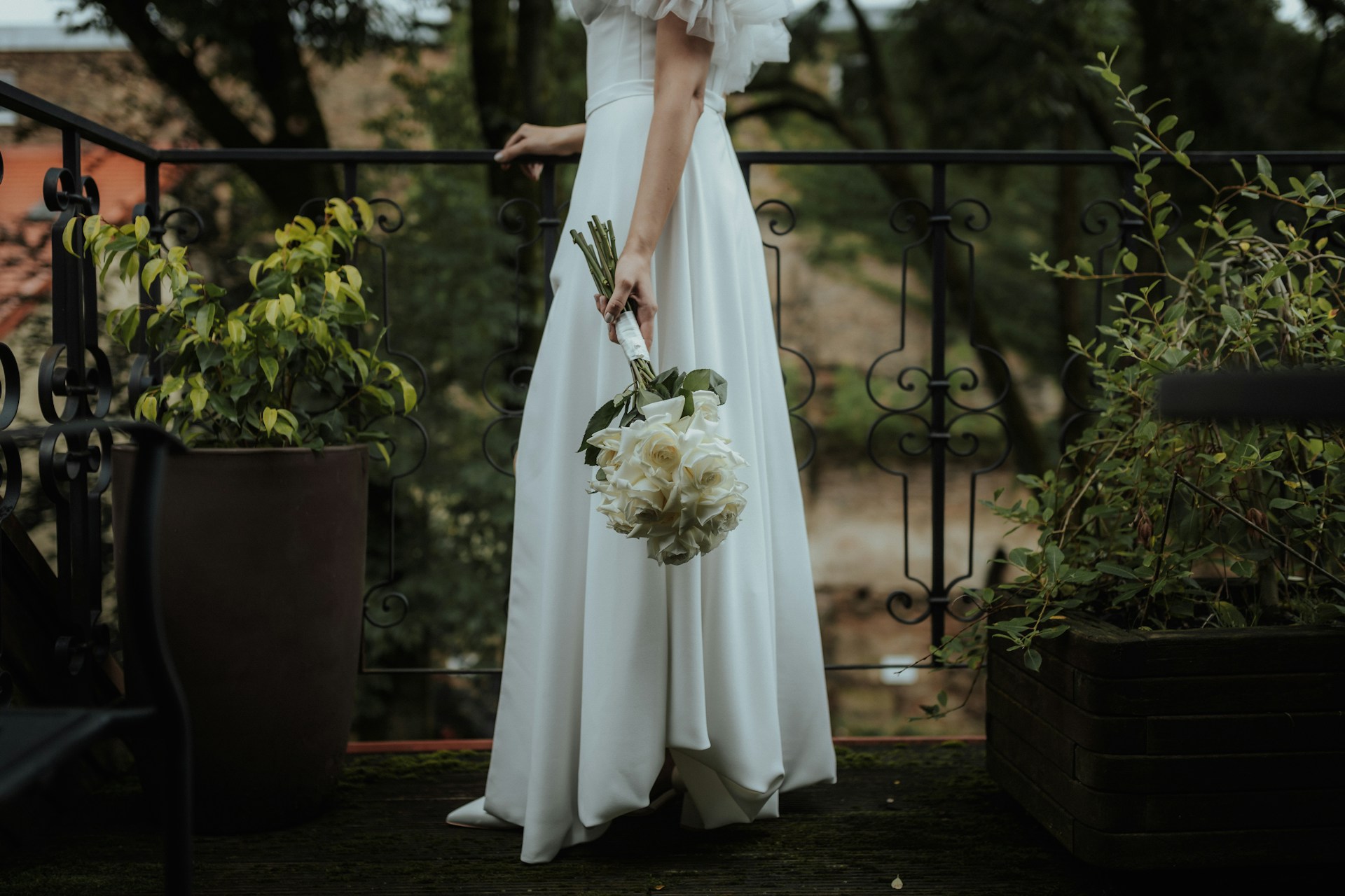 a bride holding a bouquet of flowers a bride holding a bouquet of flowers